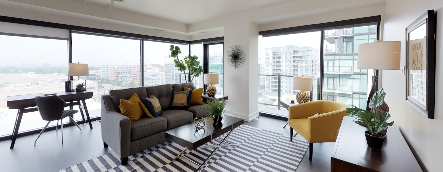 a living room with a couch and tables